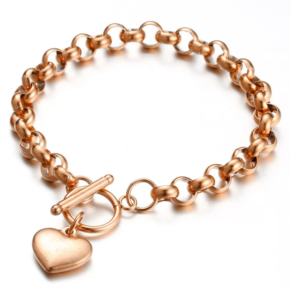 Pulsera vintage de acero inoxidable con cadena estilo keel y dije de corazón puff, cierre toggle. Joyería elegante para mujer