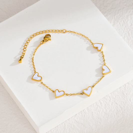 Pulsera de acero inoxidable chapada en oro, con diseño de corazones multicolor estilo gotas de aceite. Joyería llamativa y moderna