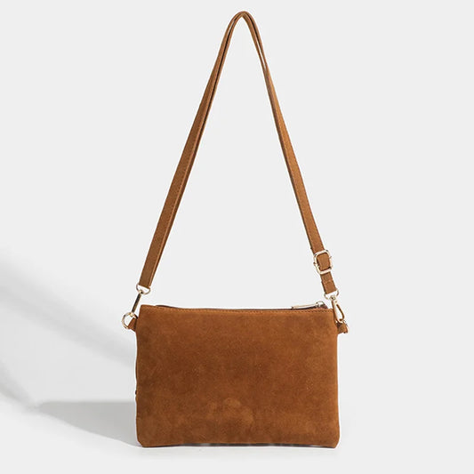 “Bolso cruzado vintage con borlas, estilo boho chic, versátil para uso diario o como regalo elegante.”