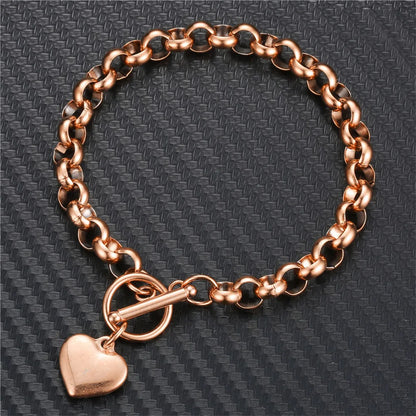 Pulsera vintage de acero inoxidable con cadena estilo keel y dije de corazón puff, cierre toggle. Joyería elegante para mujer