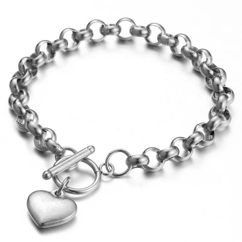 Pulsera vintage de acero inoxidable con cadena estilo keel y dije de corazón puff, cierre toggle. Joyería elegante para mujer