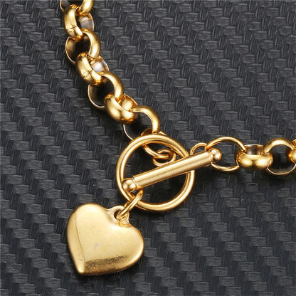 Pulsera vintage de acero inoxidable con cadena estilo keel y dije de corazón puff, cierre toggle. Joyería elegante para mujer