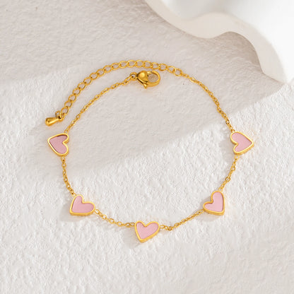 Pulsera de acero inoxidable chapada en oro, con diseño de corazones multicolor estilo gotas de aceite. Joyería llamativa y moderna