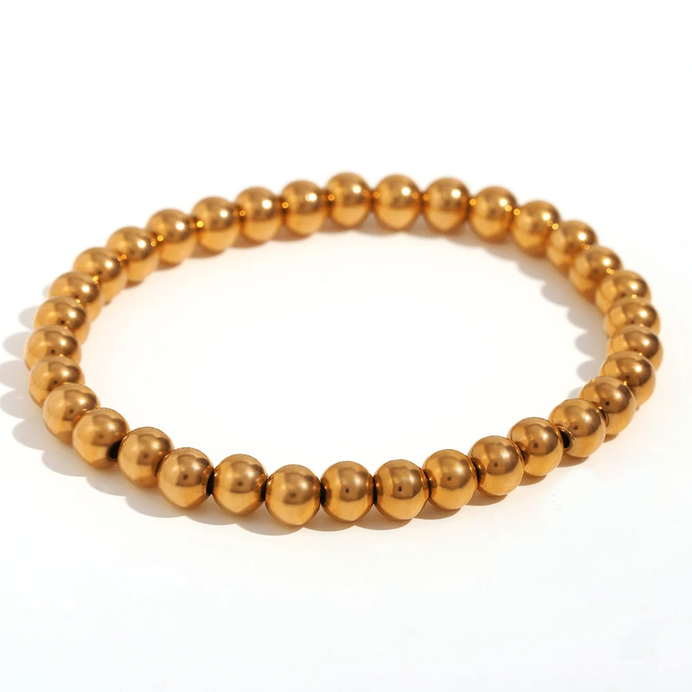 Pulsera MamacitaSlay de cuentas elásticas en acero inoxidable 316L, bañada en oro 18K. Resistente al agua, de alta calidad y perfecta como regalo elegante.
