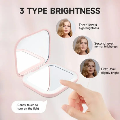 Espejo compacto con luces LED, aumento 1X/2X y diseño plegable portátil. Perfecto para maquillaje de viaje, bolso o como regalo práctico y elegante.
