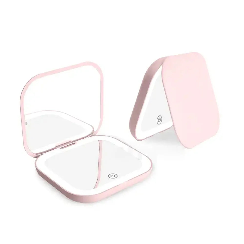 Espejo compacto con luces LED, aumento 1X/2X y diseño plegable portátil. Perfecto para maquillaje de viaje, bolso o como regalo práctico y elegante.