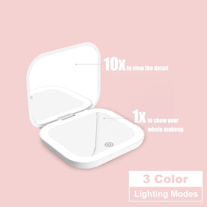 Espejo compacto con luces LED, aumento 1X/2X y diseño plegable portátil. Perfecto para maquillaje de viaje, bolso o como regalo práctico y elegante.