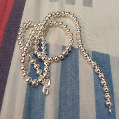 💎 Collar JewelryTop de plata esterlina 925 con cuentas lisas de 6 mm en cadena tipo bola. Longitud 45 cm, diseño elegante y moderno, ideal para mujer en bodas, compromisos o como joya de moda.