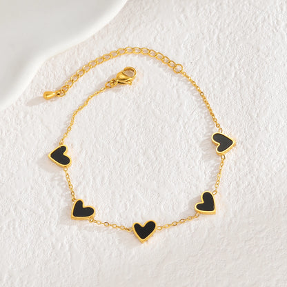 Pulsera de acero inoxidable chapada en oro, con diseño de corazones multicolor estilo gotas de aceite. Joyería llamativa y moderna