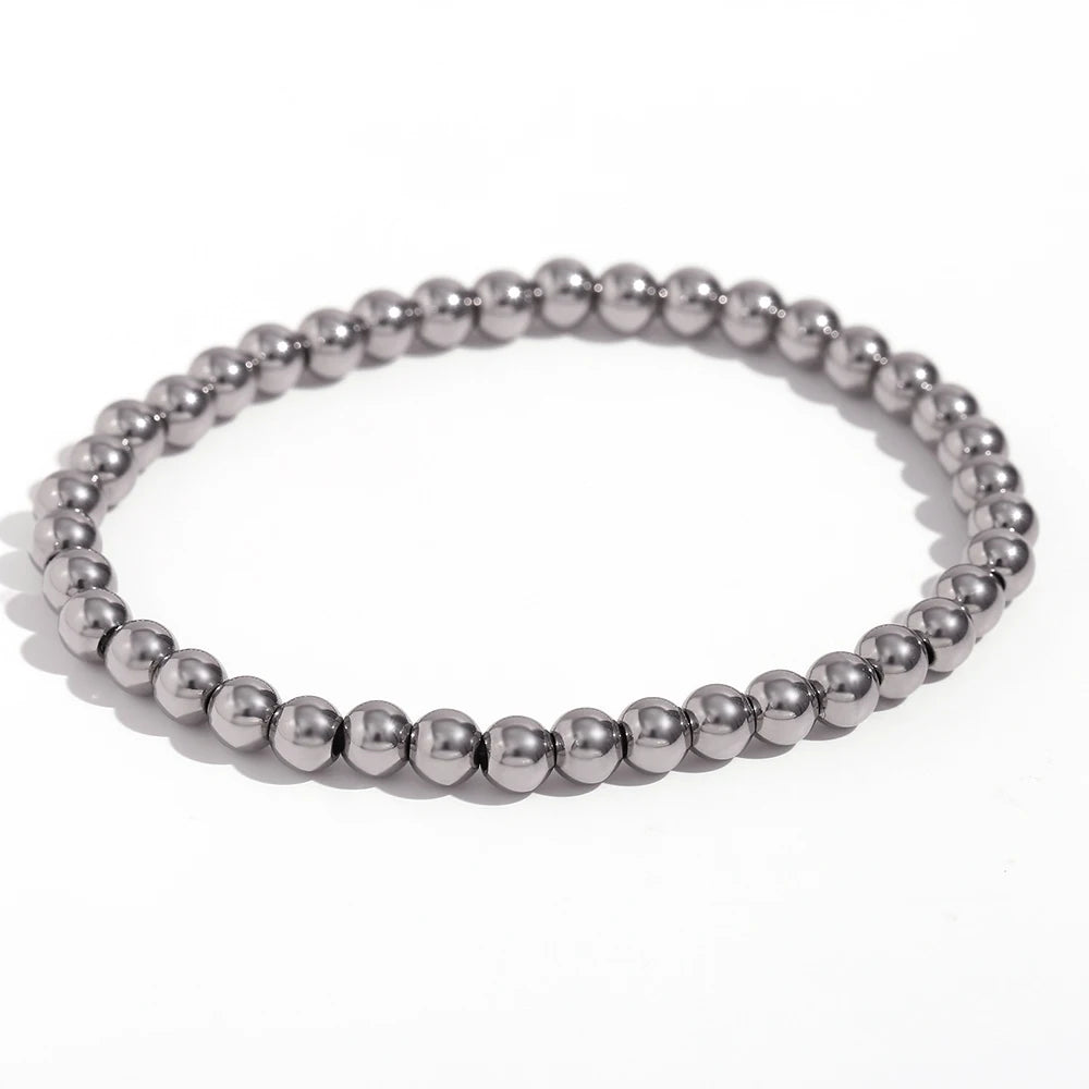 Pulsera MamacitaSlay de cuentas elásticas en acero inoxidable 316L, bañada en oro 18K. Resistente al agua, de alta calidad y perfecta como regalo elegante.