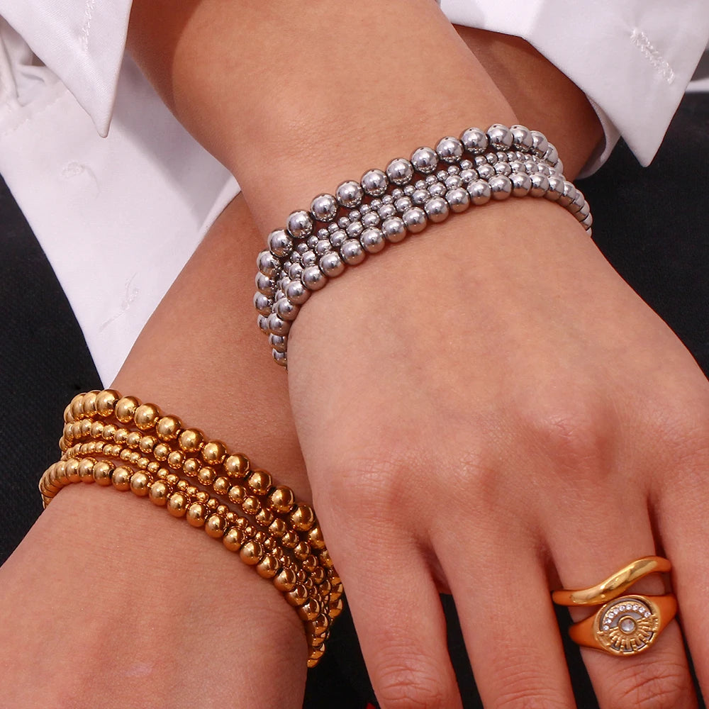 Pulsera MamacitaSlay de cuentas elásticas en acero inoxidable 316L, bañada en oro 18K. Resistente al agua, de alta calidad y perfecta como regalo elegante.