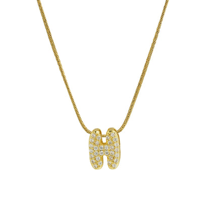 ✨ Collar inicial con letra inglesa, bañado en oro 18K y decorado con circonias incrustadas. Diseño puff/bubble llamativo, moderno y femenino, ideal para destacar tu estilo.