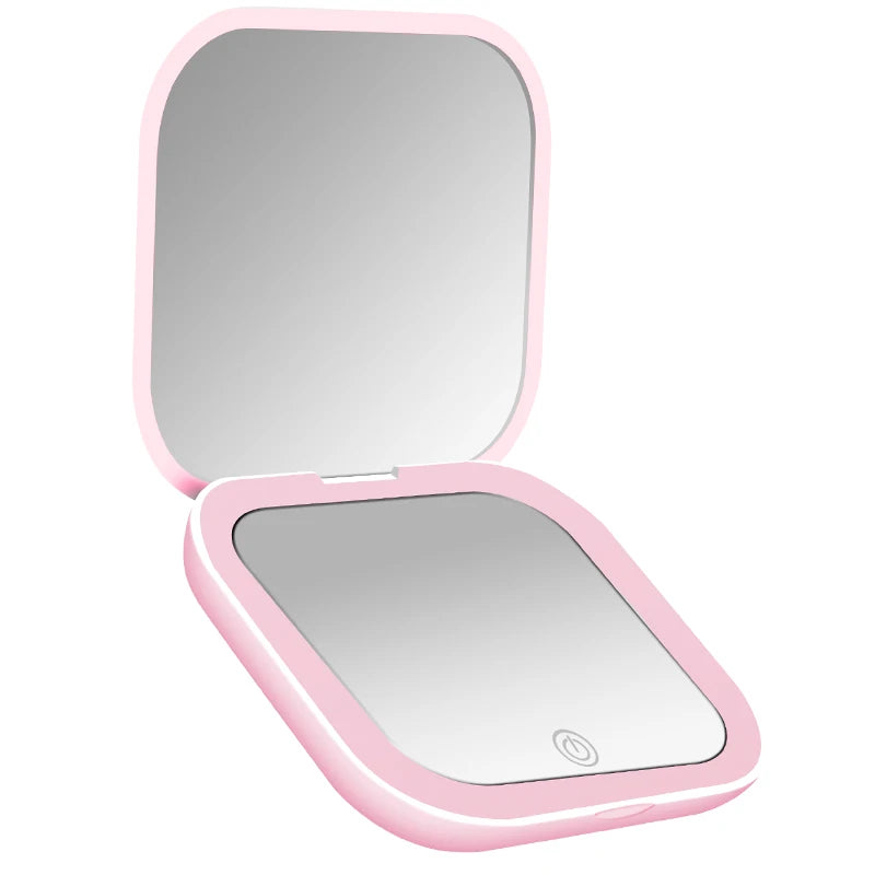 Espejo compacto con luces LED, aumento 1X/2X y diseño plegable portátil. Perfecto para maquillaje de viaje, bolso o como regalo práctico y elegante.