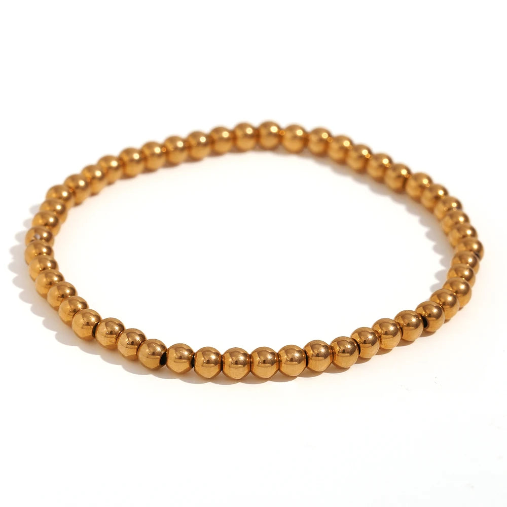 Pulsera MamacitaSlay de cuentas elásticas en acero inoxidable 316L, bañada en oro 18K. Resistente al agua, de alta calidad y perfecta como regalo elegante.