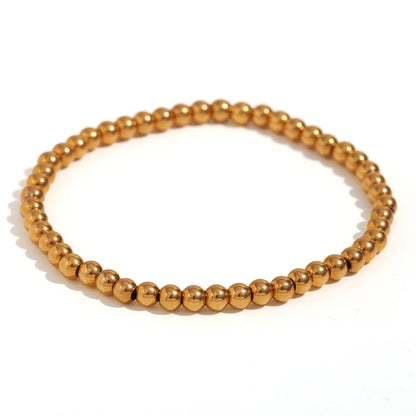 Pulsera MamacitaSlay de cuentas elásticas en acero inoxidable 316L, bañada en oro 18K. Resistente al agua, de alta calidad y perfecta como regalo elegante.