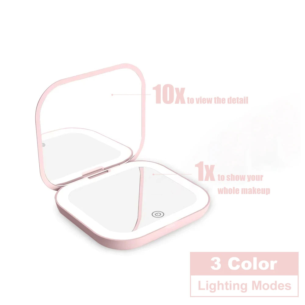 Espejo compacto con luces LED, aumento 1X/2X y diseño plegable portátil. Perfecto para maquillaje de viaje, bolso o como regalo práctico y elegante.