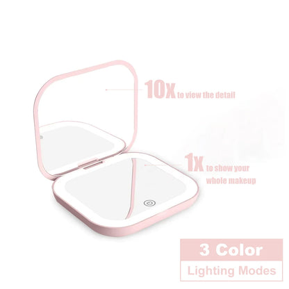 Espejo compacto con luces LED, aumento 1X/2X y diseño plegable portátil. Perfecto para maquillaje de viaje, bolso o como regalo práctico y elegante.