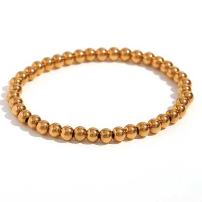 Pulsera MamacitaSlay de cuentas elásticas en acero inoxidable 316L, bañada en oro 18K. Resistente al agua, de alta calidad y perfecta como regalo elegante.