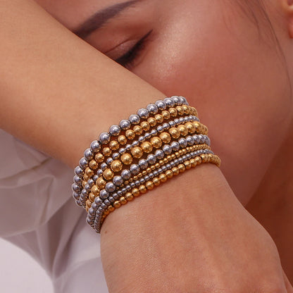 Pulsera MamacitaSlay de cuentas elásticas en acero inoxidable 316L, bañada en oro 18K. Resistente al agua, de alta calidad y perfecta como regalo elegante.
