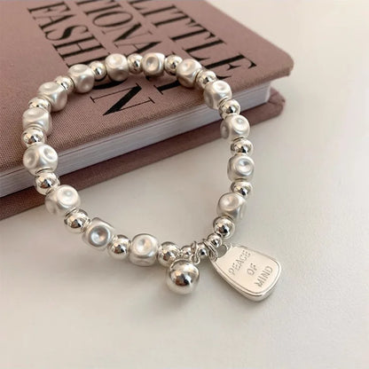 ✨Pulsera punk de plata 925 con cuentas geométricas e inscripción “Peace of Mind”. Diseño irregular y ajustable, ideal para mujer o niña. Joyería de moda perfecta como regalo especial.