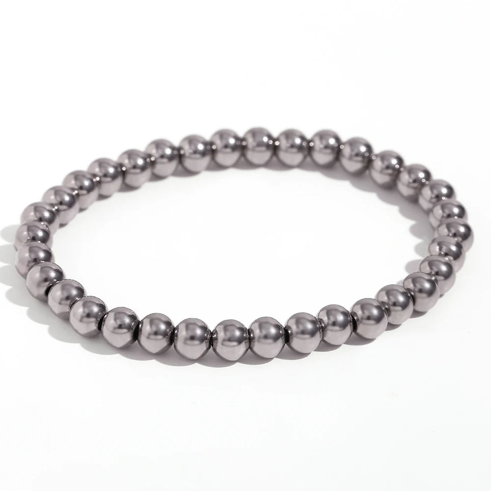 Pulsera MamacitaSlay de cuentas elásticas en acero inoxidable 316L, bañada en oro 18K. Resistente al agua, de alta calidad y perfecta como regalo elegante.