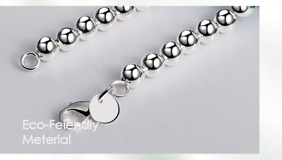 💎 Collar JewelryTop de plata esterlina 925 con cuentas lisas de 6 mm en cadena tipo bola. Longitud 45 cm, diseño elegante y moderno, ideal para mujer en bodas, compromisos o como joya de moda.