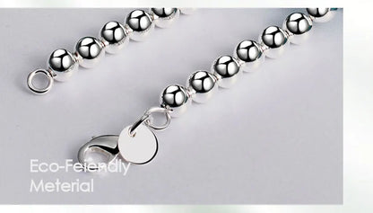 💎 Collar JewelryTop de plata esterlina 925 con cuentas lisas de 6 mm en cadena tipo bola. Longitud 45 cm, diseño elegante y moderno, ideal para mujer en bodas, compromisos o como joya de moda.